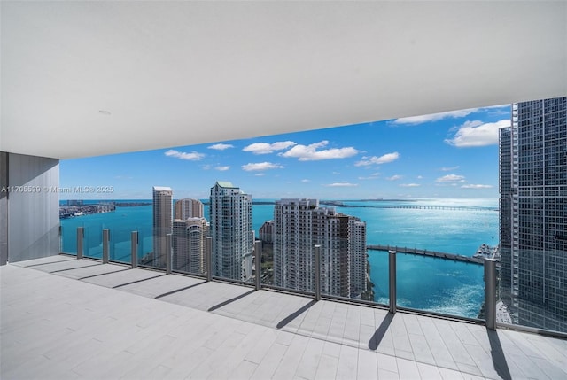 balcony featuring a water view