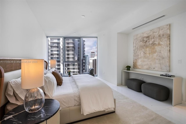 bedroom with floor to ceiling windows