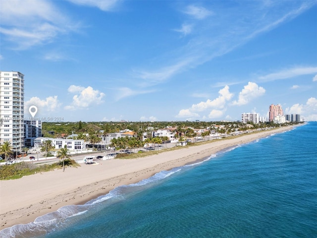 bird's eye view featuring a beach view and a water view