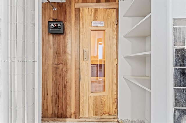 interior space featuring wood walls