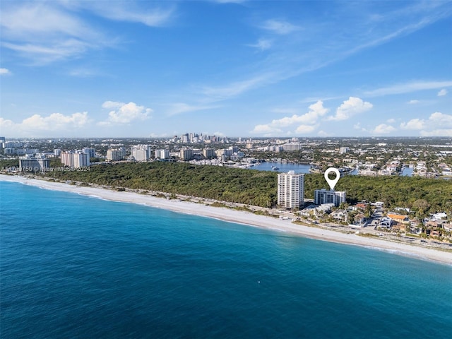 aerial view featuring a view of the beach and a water view