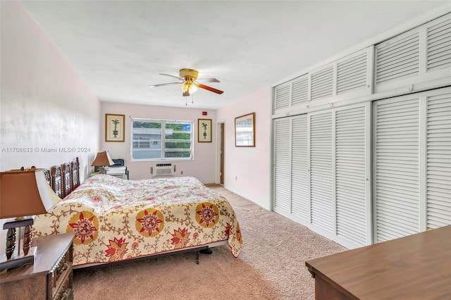 carpeted bedroom featuring an AC wall unit and ceiling fan