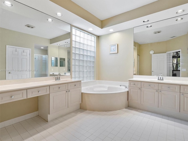 bathroom with separate shower and tub, a wealth of natural light, and tile patterned flooring