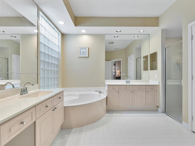 bathroom featuring tile patterned floors, vanity, and separate shower and tub