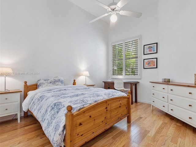 bedroom with light hardwood / wood-style flooring and ceiling fan