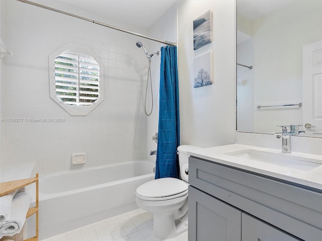 full bathroom featuring tile patterned floors, vanity, toilet, and shower / bath combo