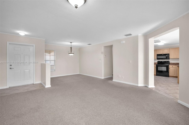 empty room with ornamental molding and light carpet