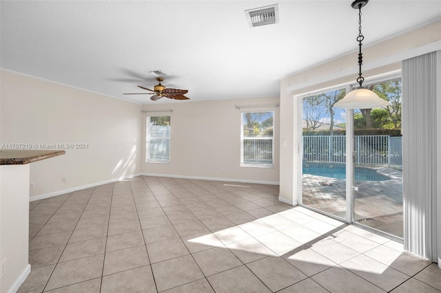 interior space featuring ceiling fan and light tile patterned flooring