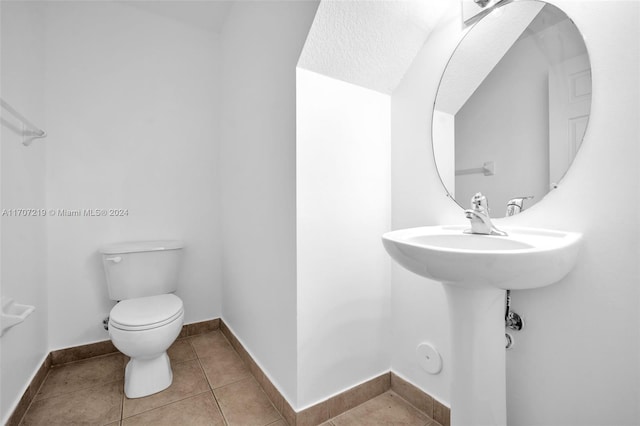 bathroom featuring tile patterned flooring and toilet