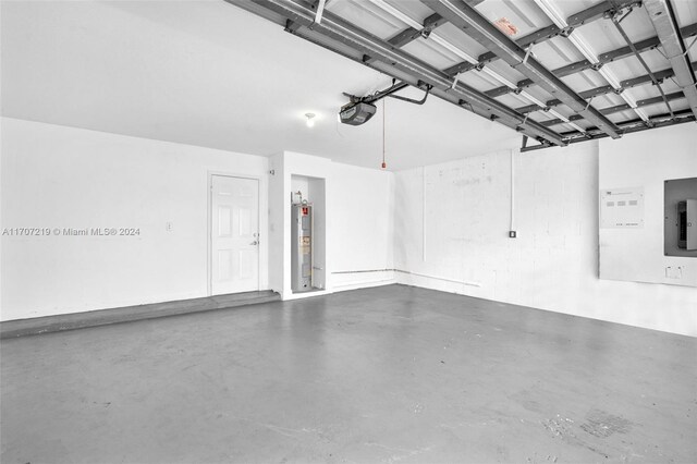 garage featuring a garage door opener and water heater