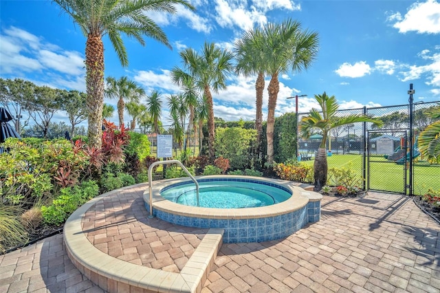 view of swimming pool featuring a community hot tub