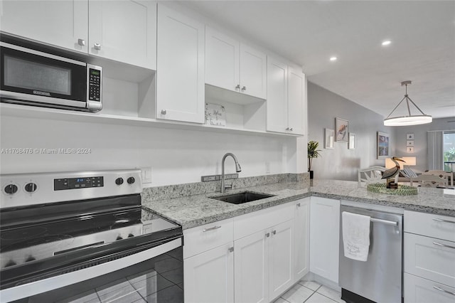 kitchen with white cabinetry, sink, and appliances with stainless steel finishes