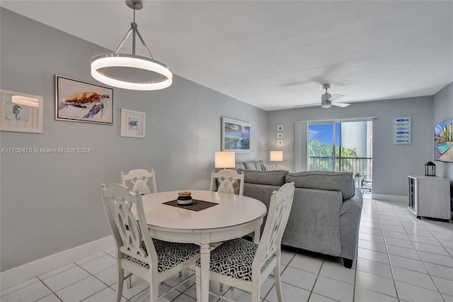 tiled dining area with ceiling fan