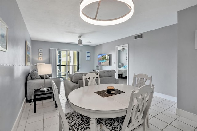 dining room with ceiling fan and light tile patterned floors