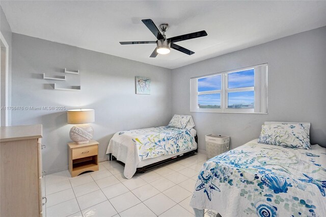 living room featuring light tile patterned floors and ceiling fan