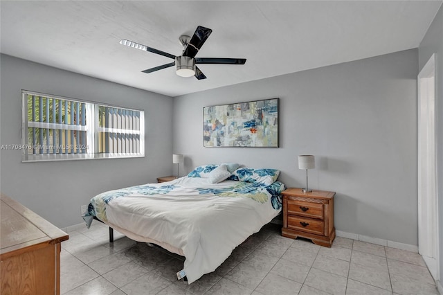 bedroom featuring light tile patterned floors and ceiling fan