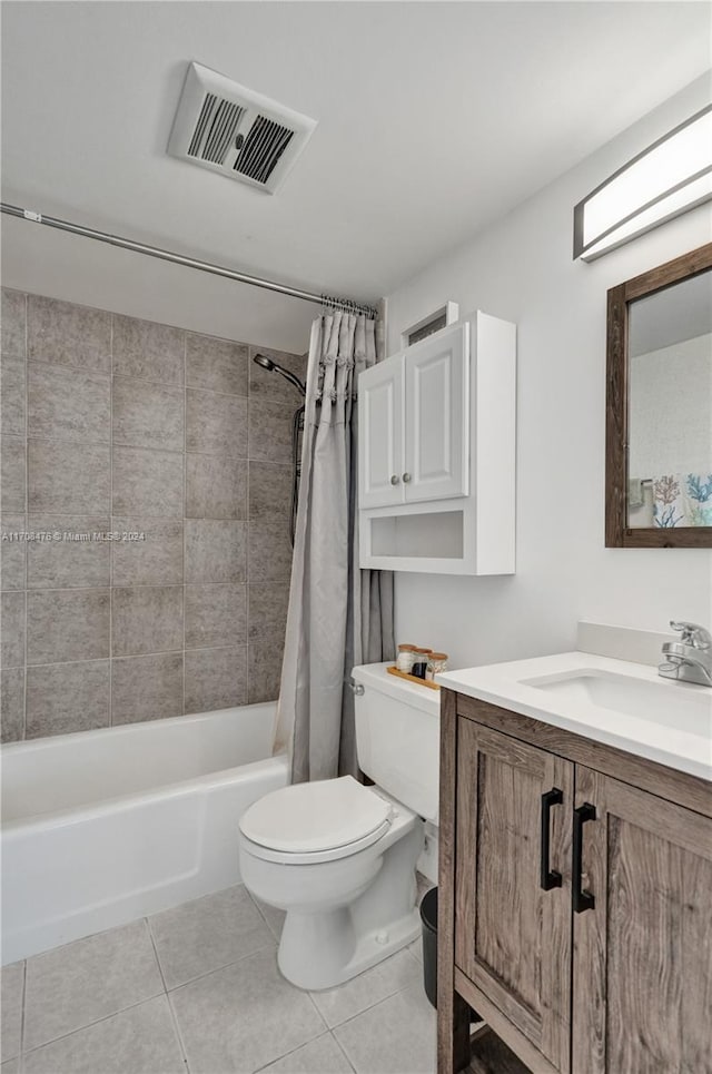 full bathroom featuring toilet, vanity, tile patterned floors, and shower / bathtub combination with curtain