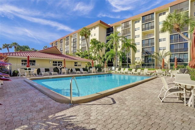 view of swimming pool featuring a patio