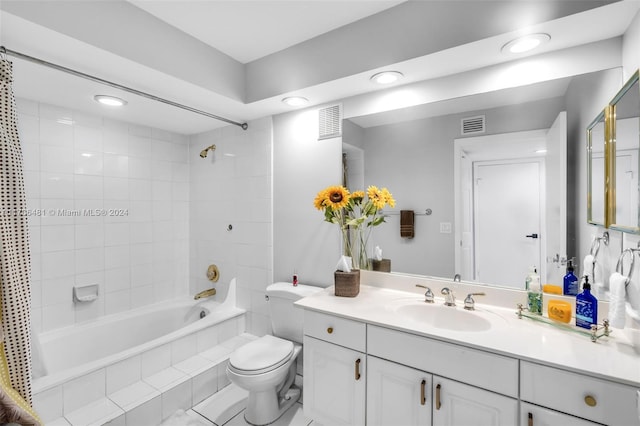 full bathroom featuring vanity, shower / bath combo, and toilet