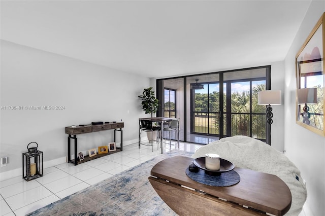 tiled living room with floor to ceiling windows