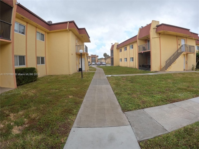 view of community featuring a lawn