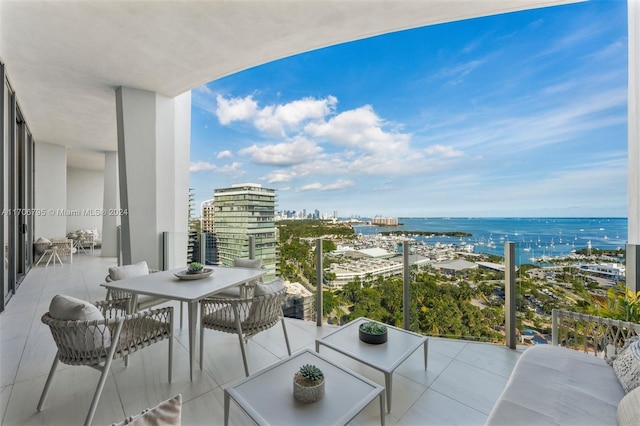 balcony featuring a water view