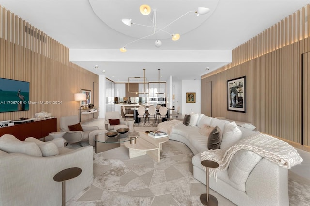 living room with an inviting chandelier