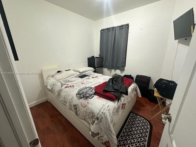 bedroom featuring dark hardwood / wood-style floors