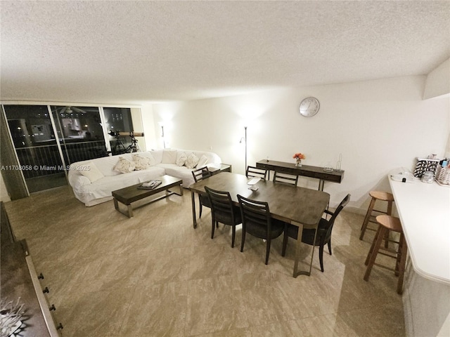 dining area with a textured ceiling