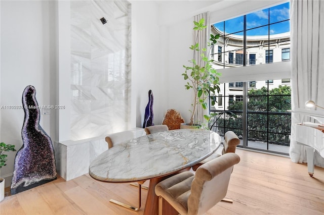 101 N Clematis St Unit 308, West Palm Beach, FL 33401 - dining space featuring wood finished floors