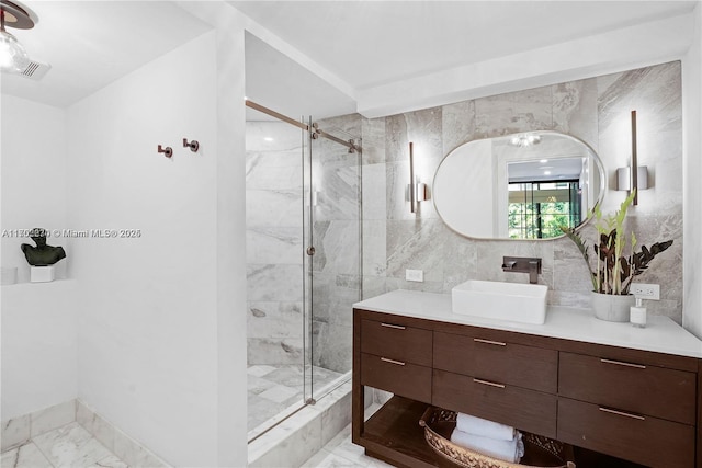 101 N Clematis St Unit 308, West Palm Beach, FL 33401 - full bathroom with marble finish flooring, vanity, a marble finish shower, and tile walls