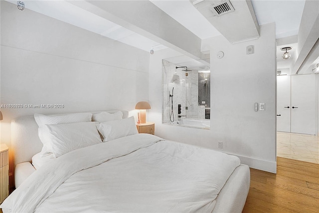 101 N Clematis St Unit 308, West Palm Beach, FL 33401 - bedroom with wood finished floors and baseboards