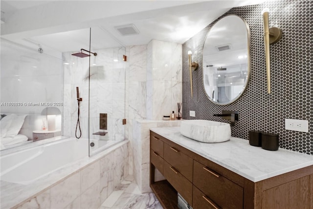 101 N Clematis St Unit 308, West Palm Beach, FL 33401 - bathroom with vanity, marble finish flooring, decorative backsplash, tiled shower / bath, and tile walls