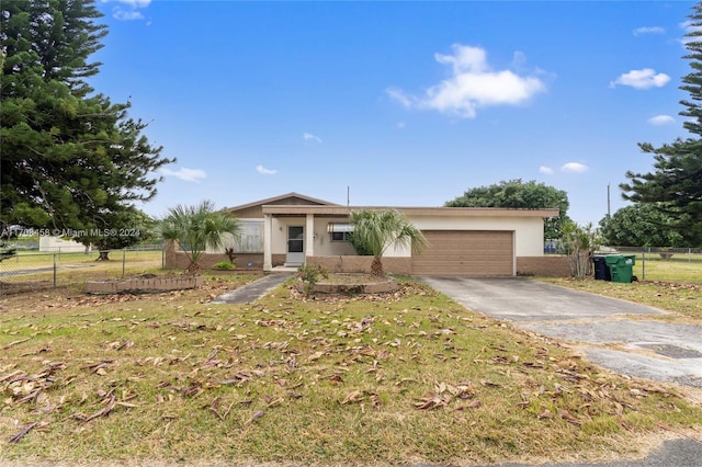 ranch-style home with a garage and a front lawn
