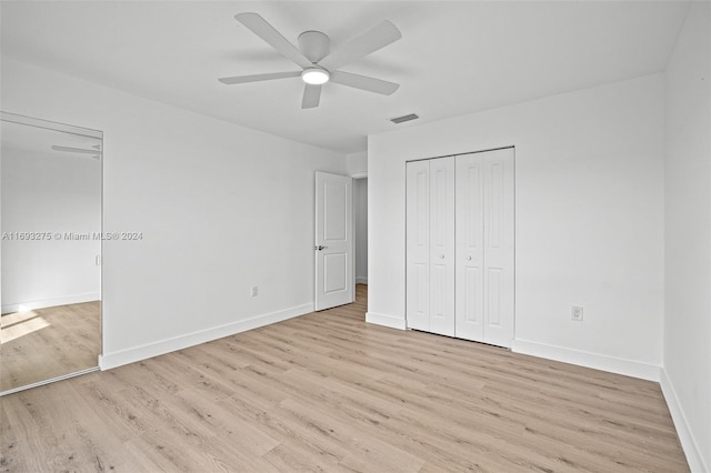 unfurnished bedroom with ceiling fan and light hardwood / wood-style floors