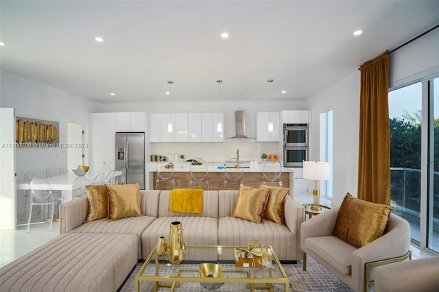 living room with light tile patterned floors and sink