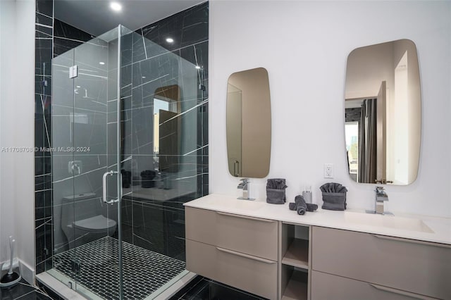 bathroom with walk in shower, vanity, and toilet