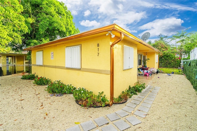 view of property exterior with stucco siding