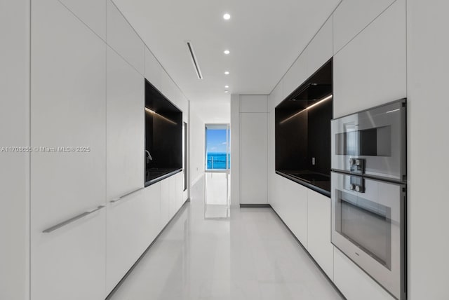 kitchen featuring white cabinetry