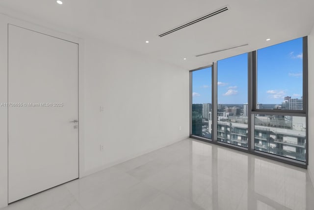 tiled empty room with expansive windows