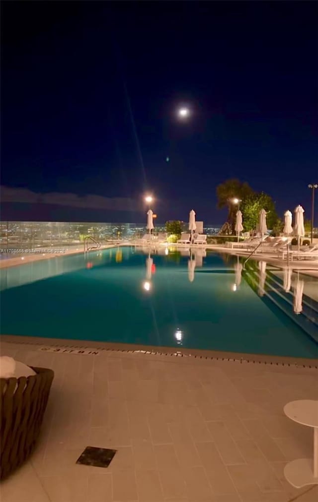 pool at night with a water view