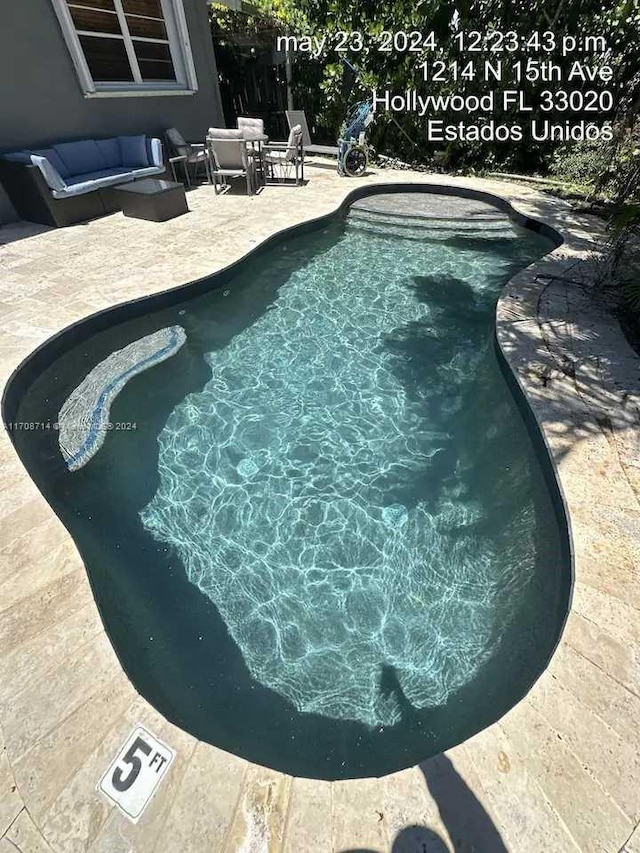 view of pool featuring a patio