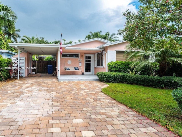 view of front of home with a carport