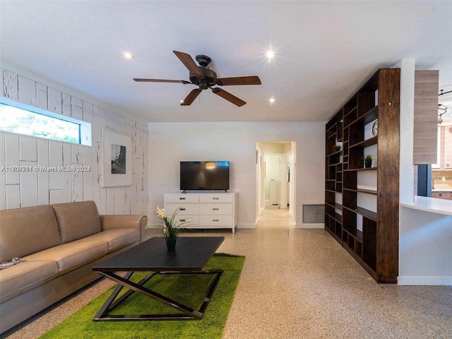 living room featuring ceiling fan