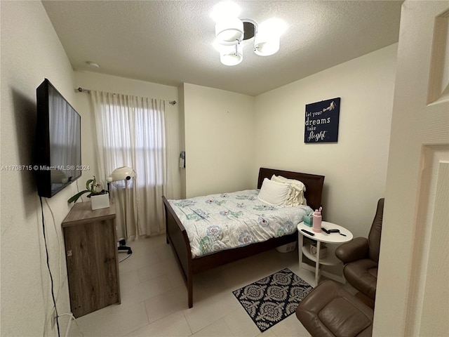 bedroom featuring a textured ceiling