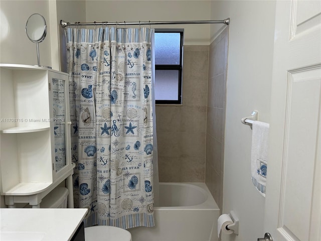 full bathroom with vanity, toilet, and shower / bath combo with shower curtain