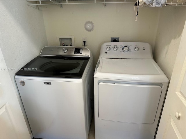 laundry area featuring independent washer and dryer