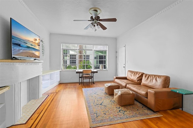 living room featuring ceiling fan and light wood-type flooring