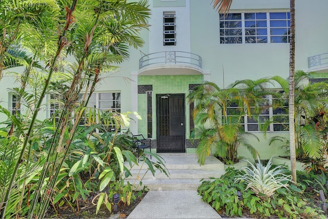 doorway to property featuring a balcony