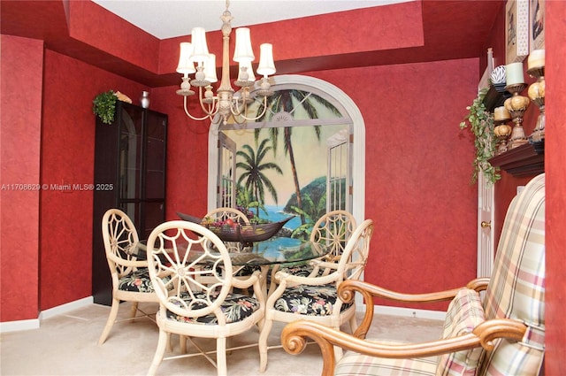 carpeted dining space with a notable chandelier